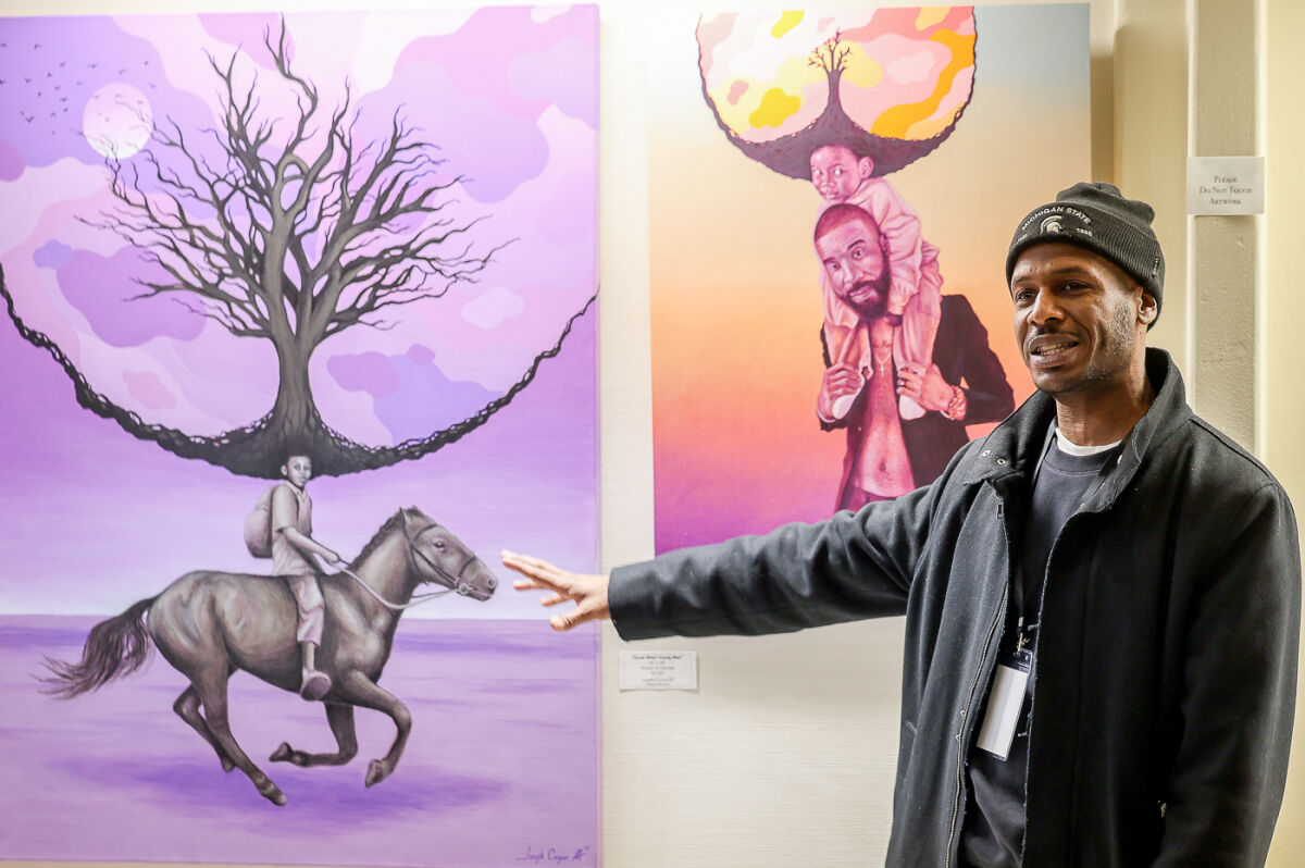  Joe Cazeno III speaks about his art during the opening reception for “Duality and Depth” Jan. 15 at Southfield City Hall. 