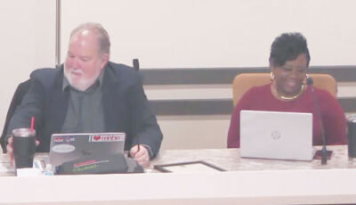  Following a vote to receive and file the capital improvement plan at the Madison Heights City Council meeting Jan. 12, Madison Heights Mayor Pro Tem William Mier, left, shares his thoughts on an upcoming road millage renewal that voters will decide this August. Next to him is Toya Aaron, who returned to the council last November. 