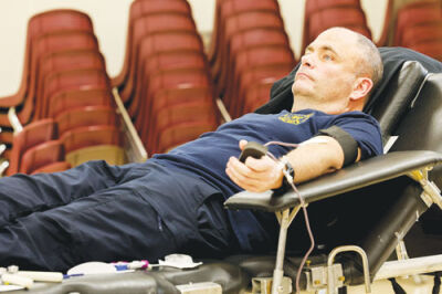  Roseville Fire Chief Keith Jacobs donates blood March 28, 2025, during a blood drive at the Recreation Authority of Roseville and Eastpointe. Earlier this month, the American Red Cross announced there is a blood shortage as donations are down 35% nationwide.  