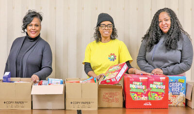  Members of Eastpointe’s Arts and Cultural Diversity Commission helped with food donations through the Eastpointe Memorial Library. Pictured, from left, are Vice Chair Pamela Russell, Chair Wanda Moody and member Kai Hayes. 
