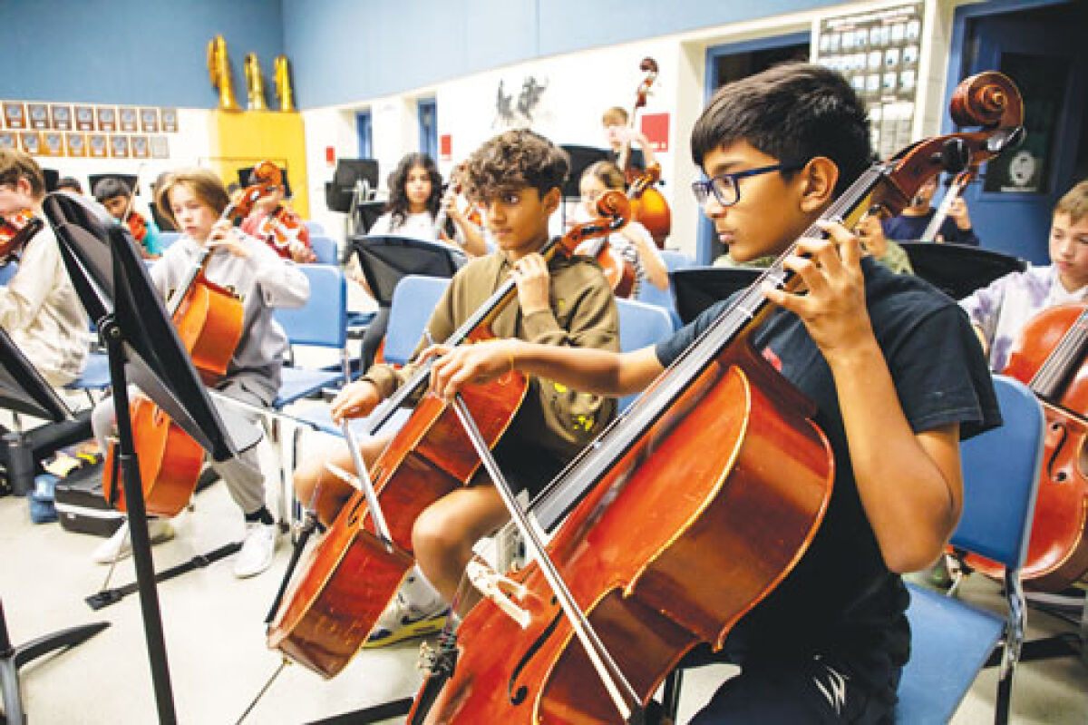  Troy School District students practice during orchestra class. 