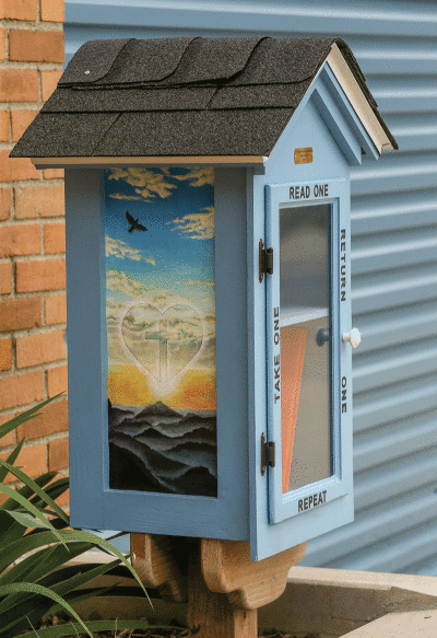   Lincoln Middle School art teacher John Lonsway painted the lending library in honor of parent Madinah Alexander. 