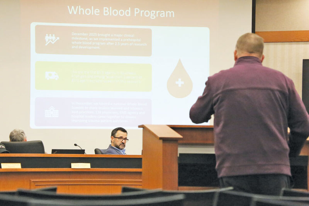  Macomb Township Supervisor Frank Viviano, middle, listens to Medstar CEO Kolby Miller deliver a presentation about the Clinton Township-based ambulance service’s work in the township at the Jan. 21 Macomb Township Board of Trustees meeting. 