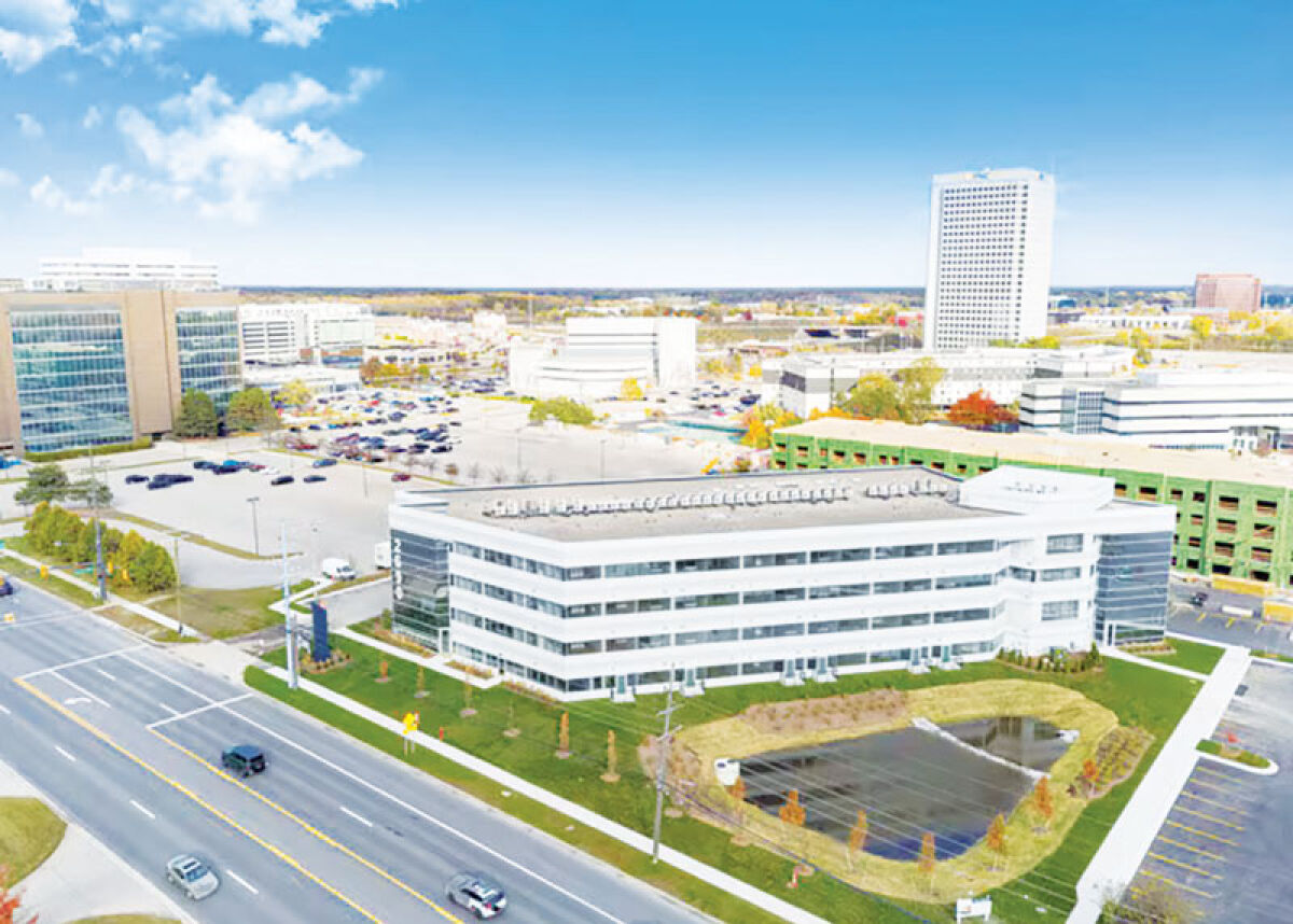  Lindsey Living Apartments, 2690 Crooks Road, includes an 88,000-square-foot former office building converted into apartments, and a separate five-story building now under construction. 