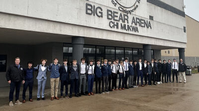  South Lyon Unified poses in front of Big Bear Arena in Sault St. Marie, Michigan, this past November. 