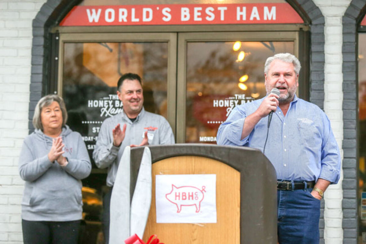  Honey Baked Ham franchise business leader Richard Kolleth gives comments at the celebration. Kolleth started with the company in 1980. Behind him are Roseville general manager Tina Gardzinski, left, and district manager Karl Merkle. 
