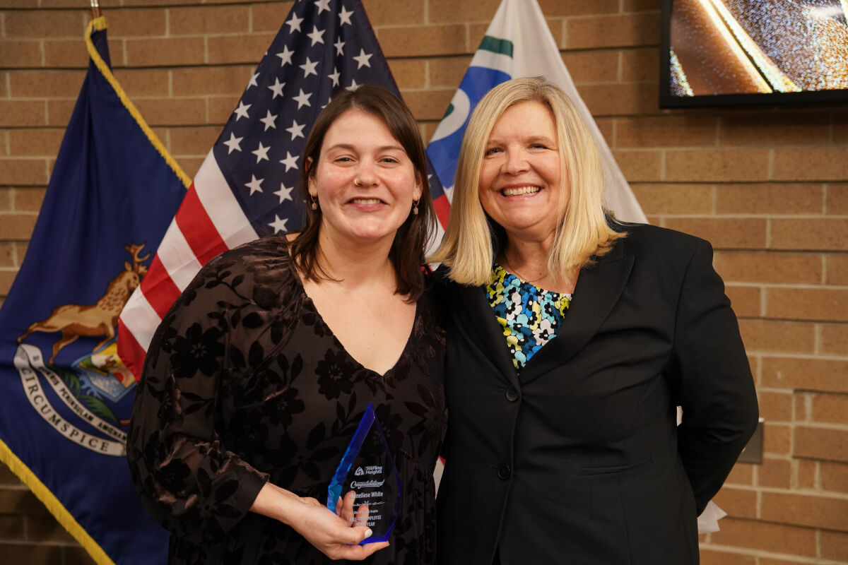  Anneliese White, left, received her Employee of the Year award from Sterling Heights Library Director Tammy Turgeon on Jan. 20. 