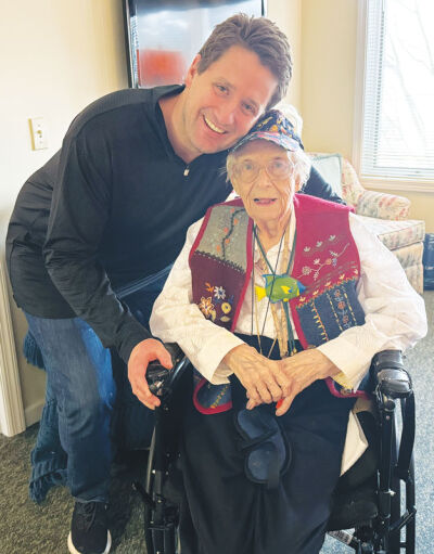  Jeff Hohlfeldt and Marjorie Nank pose for a photo in her home in St. Clair Shores. 