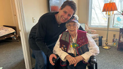  Jeff Hohlfeldt and Marjorie Nank pose for a photo in her home in St. Clair Shores.   