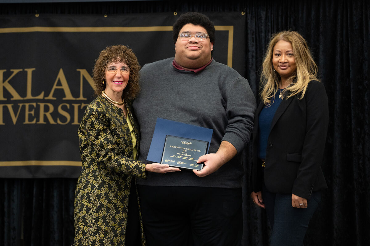  From left, Oakland University President Ora Hirsch Pescovitz, Marcus Johnson and Vice President of Inclusion, Engagement and Strategic Partnerships at Comerica Bank Wendy Holmes pose for a picture at the Oakland University Keeper of the Dream Scholarship Award Ceremony Jan. 19 in Rochester. 