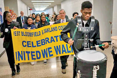 Students and adults celebrate the 32nd “United We Walk” Jan. 18, commemorating the birthday of Dr. Martin Luther King Jr. and the message that all people are worthwhile. 