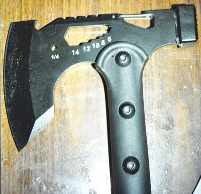  Police say the suspect used this hatchet to attack a visitor to his Hazel Park home. 