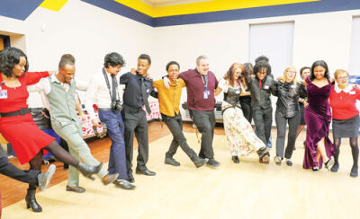  Students, staff and guests formed a kick line during the senior prom. 