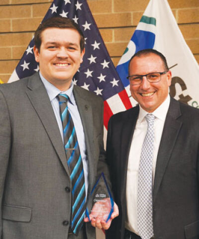  Lucas Kernen, left, is the Sterling Heights Parks and Recreation Department part-time employee of the year. At right is department Director Kyle Langlois. 