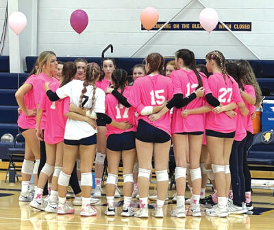  Royal Oak Shrine Catholic’s volleyball team huddles up before its pink out game against Riverview Gabriel Richard Oct. 12. 