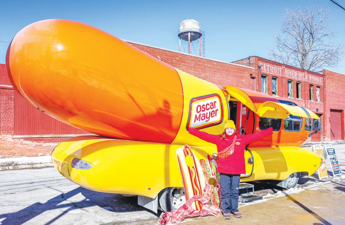  Grosse Pointe City native — and Hotdogger — Bridget Doyle stands in front of the Oscar Mayer Wienermobile during a stop at Valade Park in Detroit Feb. 8. 