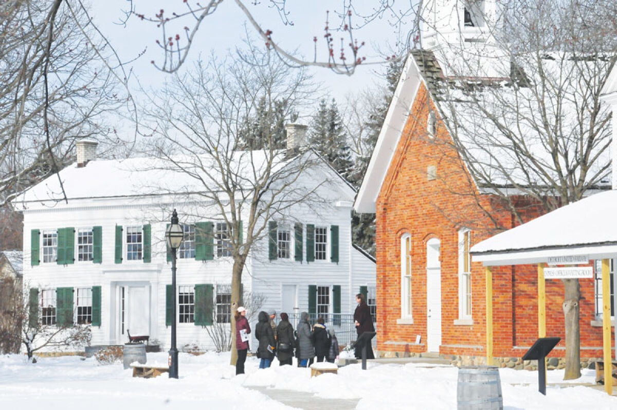  Guests visiting the Troy Historic Village during a previous open house. 