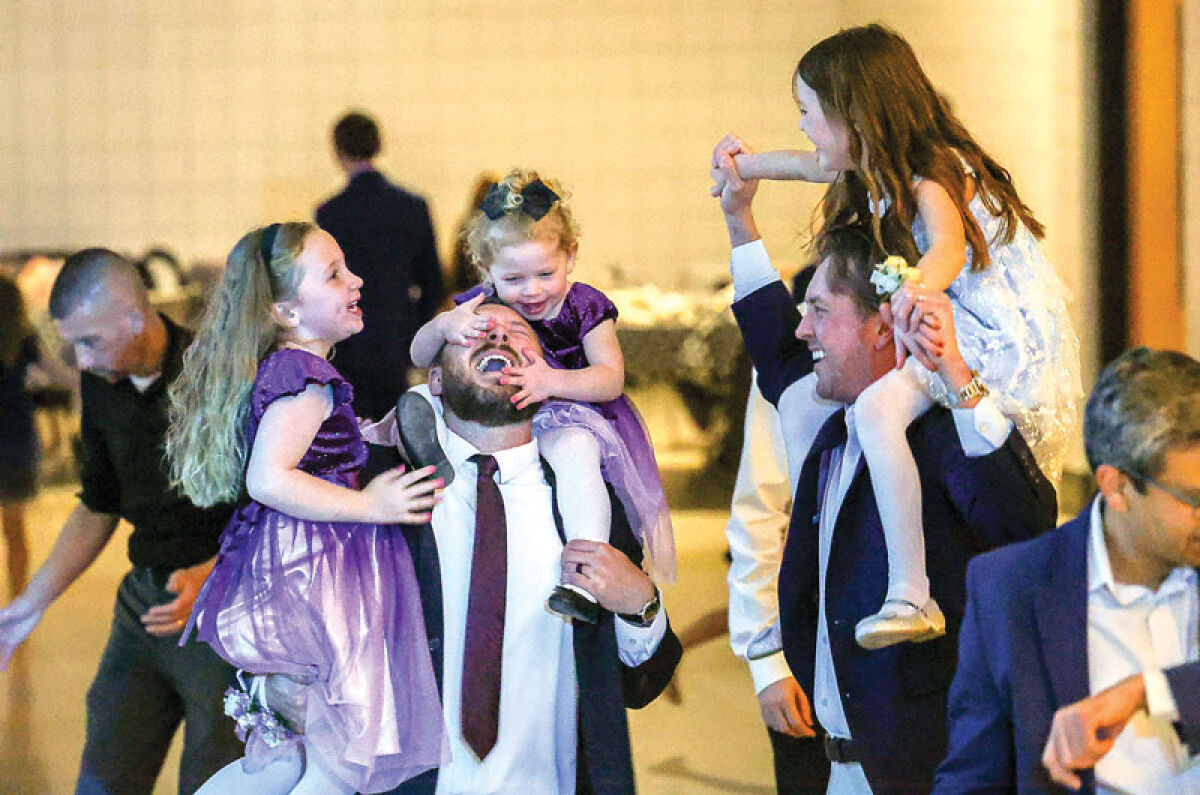  Fathers and daughters enjoy time together during the 2.p.m. daddy-daughter dance at the Novi Civic Center on Feb. 7. 