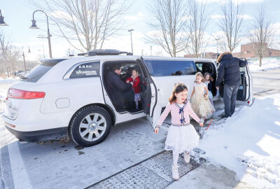  A group of young ladies and their dads arrive in a limousine. The limo was the idea of their friend, Lydia Pietraz. 
