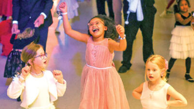  Young girls and their fathers dance the afternoon away during the 2 p.m. daddy-daughter dance at the Novi Civic Center on Feb. 7. 
