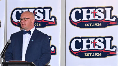  Mike Evoy speaks at the Catholic High School League Hall of Fame banquet in 2022, where he was an inductee. 