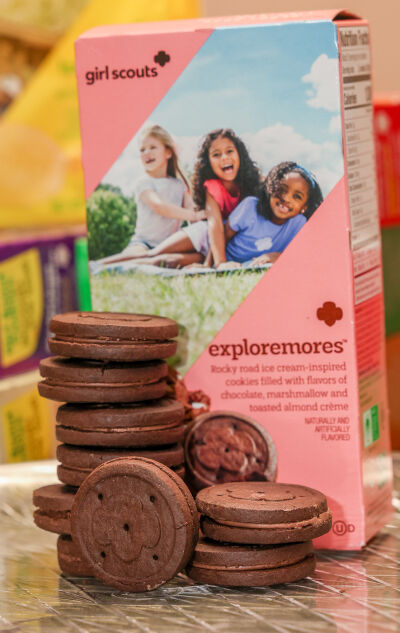  The newest Girl Scout cookie “Exploremores” was inspired by “rocky road” ice cream and blends together chocolate, marshmallow and toasted almond crème.  