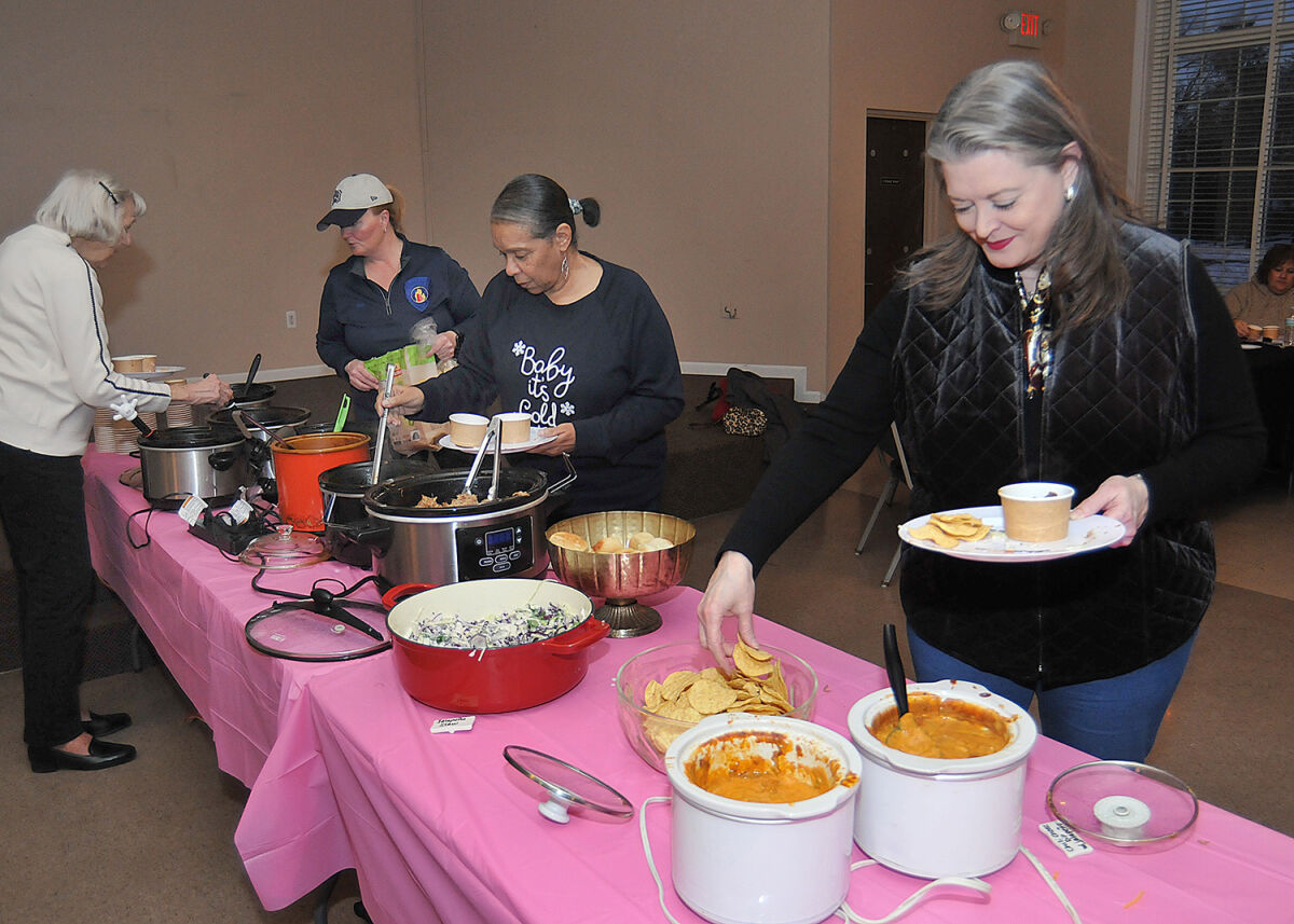  People serve themselves at the fifth annual Lathrup Village Police Department chili dinner on Feb. 12. 
