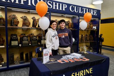  Alba and his mother smile after his commitment. Alba attributes a lot of his success to his mom’s support. 