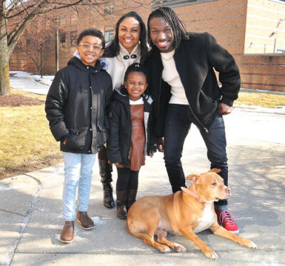  The Brinkley family was recently recognized at a Madison Heights City Council meeting: (from left) Bass Brinkley, 8, Ya’Laina Brinkley, 5, Gabrielle Brinkley and La’Bron Brinkley, with the family dog, Nala.  