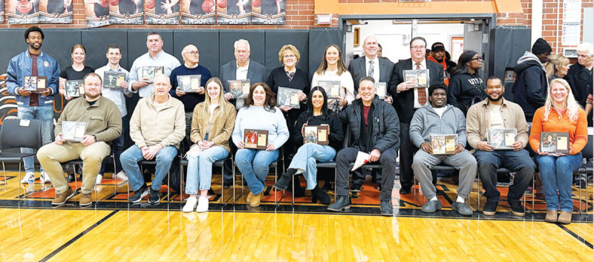  The Utica High School Hall of Fame Class of 2026 poses for a  photograph after the induction ceremony at the school on Jan 16.  