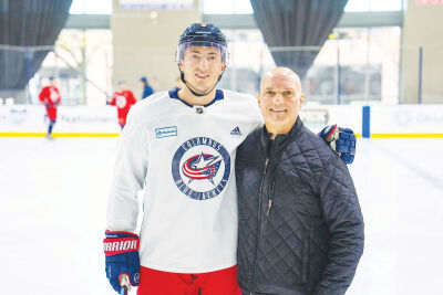  Zach Werenski and his father, Grosse Pointe Shores Public Safety Director Kenneth Werenski, smile during a Columbus Blue Jackets dads trip in 2023. 
