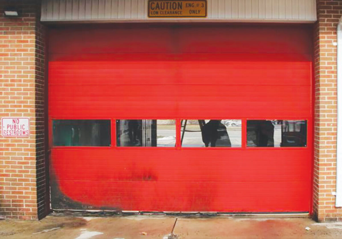  Fire damage is visible on the garage door at Southfield Fire Station #3. 