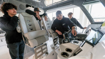   Jefferson Beach Yacht Sales marine technician Vince Fisher takes Utica Community Schools students all around an HCB Yacht and its engines cabin electronics Feb. 26 in St. Clair Shores.  
