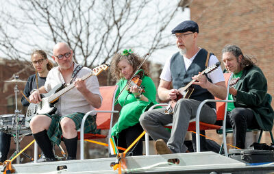 The Detroit Celtic Ramblers perform while being driven along the parade route last year.
