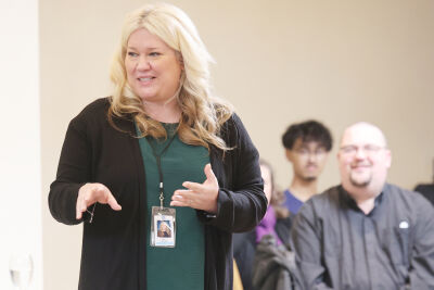  UCS school board President Mary Smolenski addresses students and teachers involved in collecting the food.  