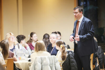 Utica Community Schools Board of Education Treasurer Steven Meyer speaks with students prior to breakfast  