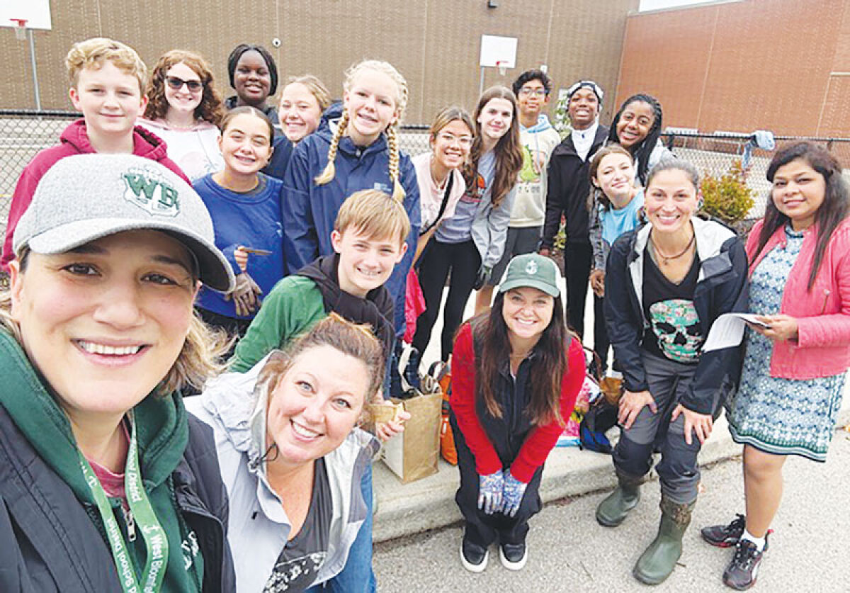  The Junior Leadership Commissioners plant daffodils and native wildflowers at West Bloomfield Middle School. They are joined by Sally Wenczel, a member of the township’s Environmental Commission, and Kelly Hyer, executive director of West Bloomfield Parks and Recreation, as well as Dania Bazzi, superintendent of the West Bloomfield School District. 
