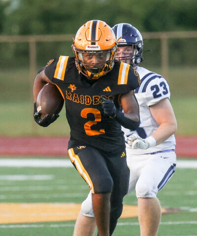  Leland Holingsworth, of North Farmington High School, breaks off a run against Livonia Stevenson in a 2025 matchup. 
