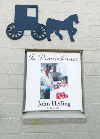  A memorial for John Hefling hangs outside of Hefling’s Amish Farm Market. John Hefling, owner of Hefling’s Amish Farm Market, passed away on Feb. 17.  