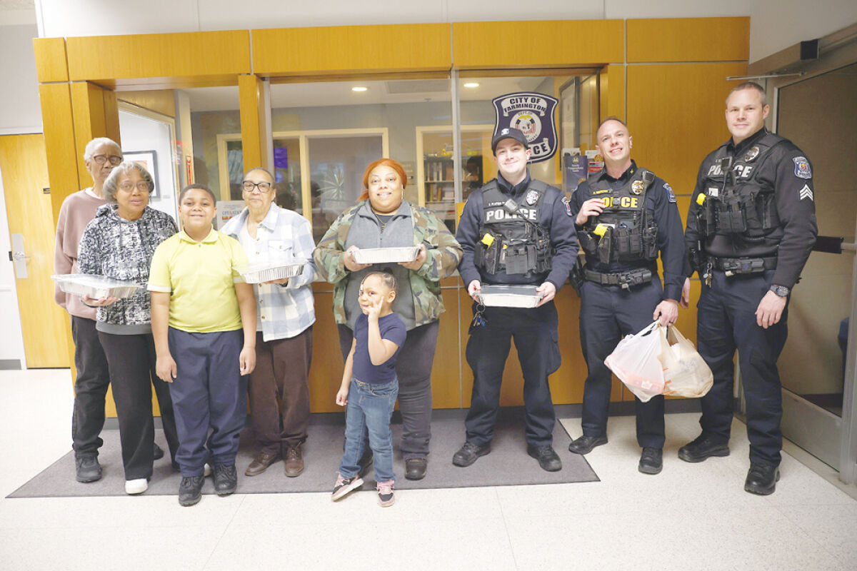  The Montgomery Family celebrates Farmington Public Safety officer Nash Plafkin, third left, with a dinner for him and his entire shift, thanking for going beyond the call of duty. Also present are Commander Cody Hawkins, second left, and Sgt. Michael Weir. 
