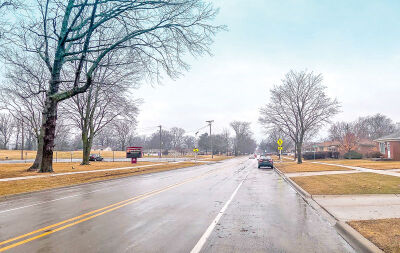  In Eastpointe, near Spindler Park, pictured, the road has sidewalks on both sides and designated on-street parking. 