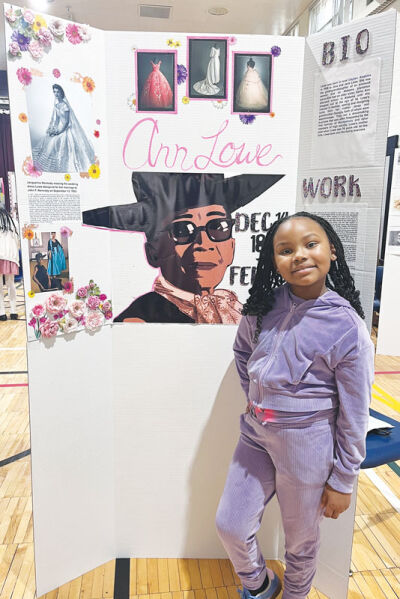  First grade student Elle Burton shares a common bond with Ann Lowe. They have the same birthday, Dec. 14, and Burton also is a budding fashion designer. 