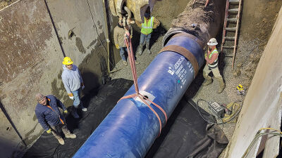  Workers repair a section of Water Main along 14 Mile Road in Farmington Hills that caused a large part of Novi to lose water service on Saturday and that has the city under a boil water advisory March 9. 