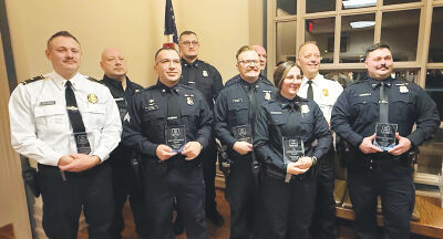  Several of the Grosse Pointe Shores Public Safety officers honored for their work in 2025 pose for a photo with Public Safety Director Kenneth Werenski at Shores City Hall. 