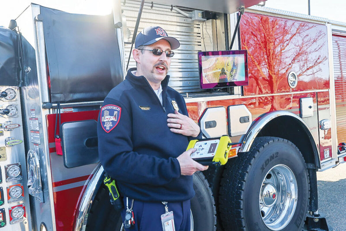  Southfield Deputy Fire Chief Jason Deneau demonstrates the remote controlled camera system on the Fire Department’s new Sutphen Aerial Tower 5 on March 9 at the Southfield Municipal Building. 