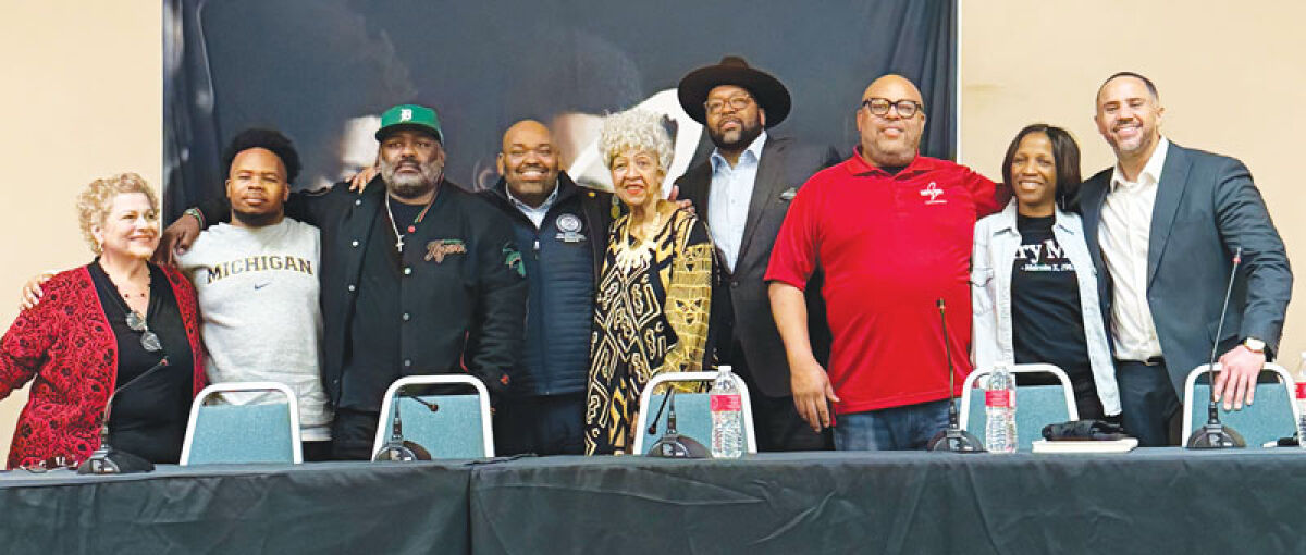  Panelists and members of Boys 2 Men Youth Mentoring pose for a photograph at the Lathrup Village Black History Month panel on Feb. 26 at City Hall. 