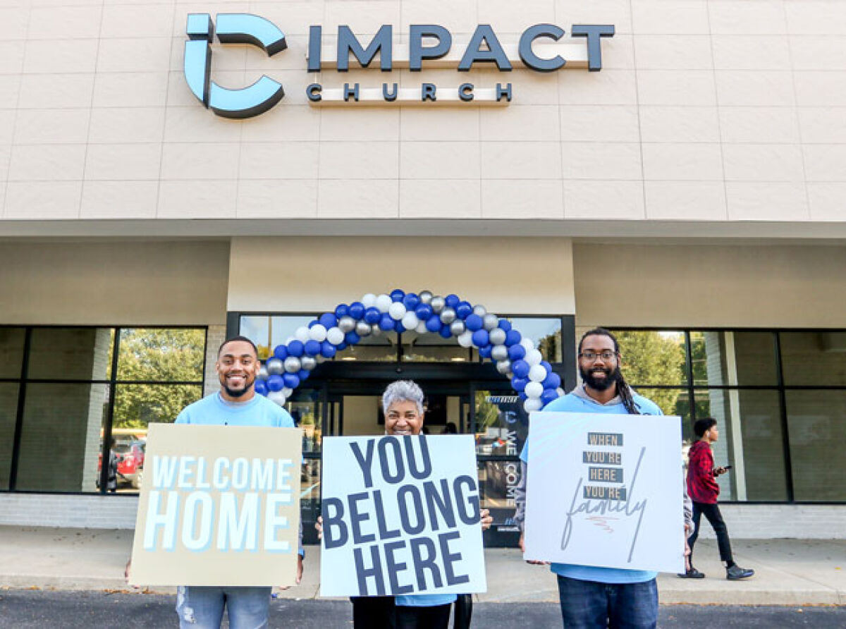  Members of Impact Church, 22104 Novi Road, greet visitors during the church’s two-day grand opening Oct. 1-2. 