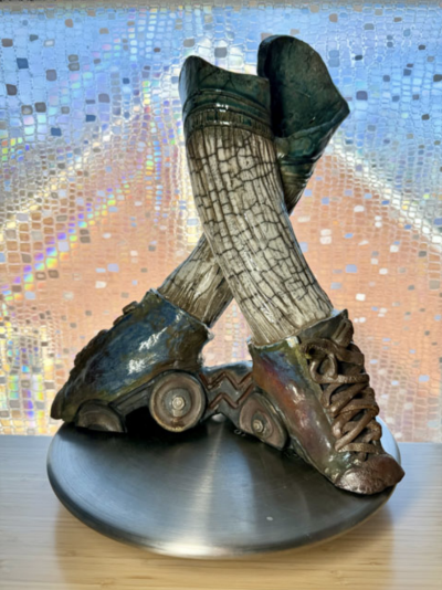  This piece of art made by Tracy Gabry and featured in the Lawrence Street Gallery’s show is titled “Seven Deadly Spins.”  