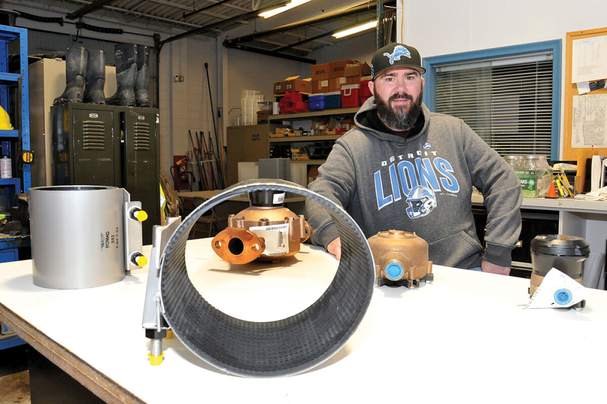  Matt Hallett, the water and sewer coordinator for the Madison Heights Department of Public Services, shows some water meters and pipes used for municipal and residential water line repairs. Officials say cost increases in water and sewer — passed along by the city’s service providers — are putting a strain on the city’s budget for infrastructure. 