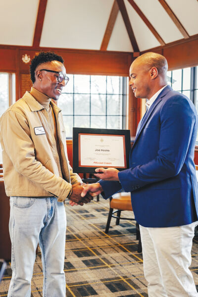  Detroit Golf Club President Keith Hazely presents an exemption  for the 2026 Rocket Mortgage Classic to Joe Hooks on March 13  at the Detroit Golf Club. 